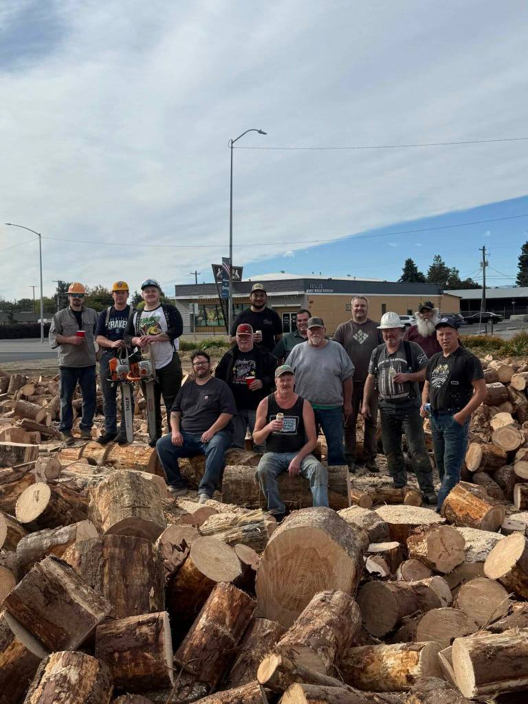 Lions Club photos Taking a break from cutting firewood in Quincy.