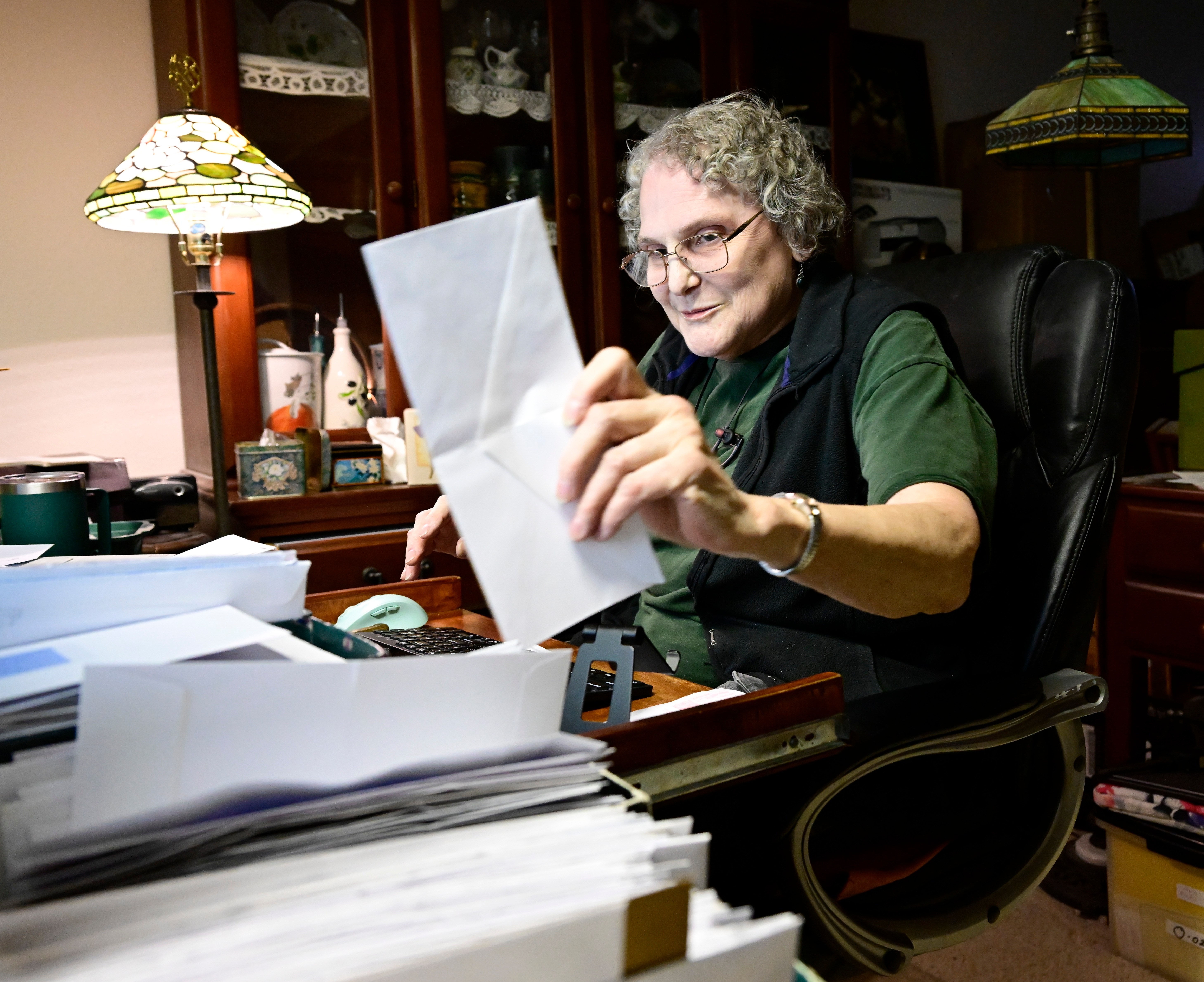Mary Buckingham logs one of thousands of letters in the basement office at her home in Greeley on Wednesday, Jan. 31, 2024. The letters are from people requesting free sour dough starter that has lineage dating back from the Oregon Trail in 1847. (Photo by Andy Cross/The Denver Post)
