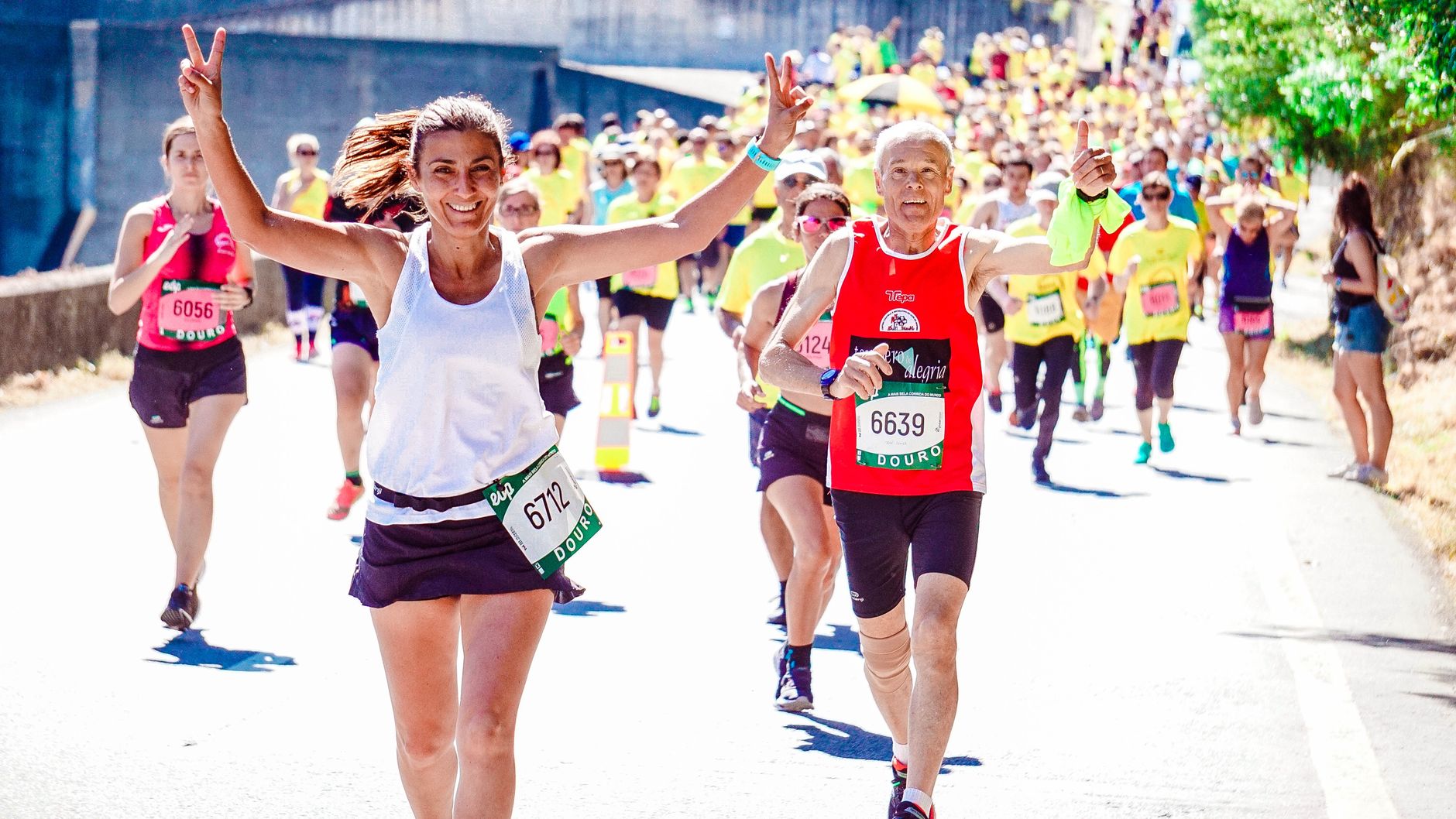 Volunteer running guides partner with visually impaired athletes across international marathons