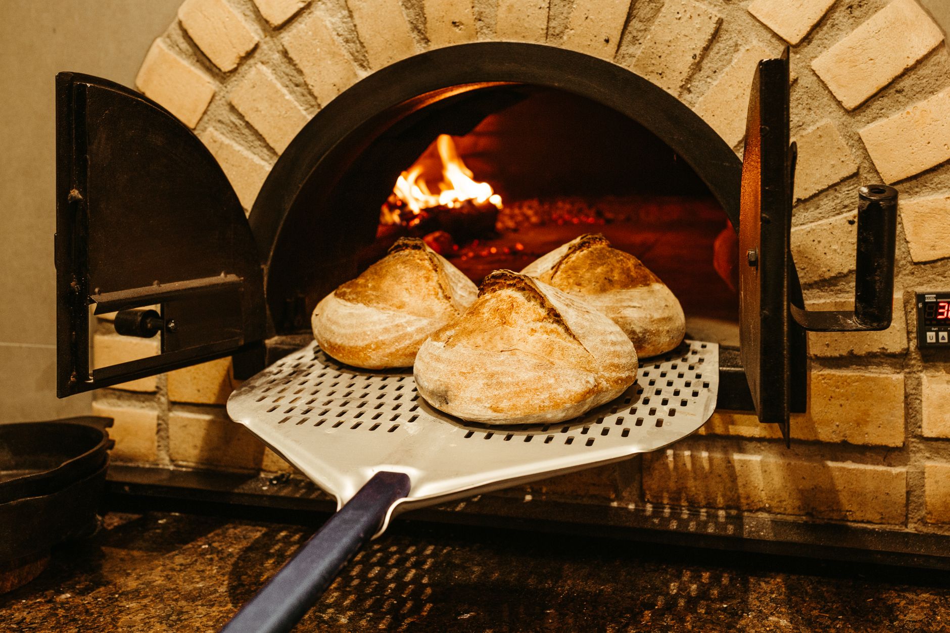 Neighborhood park wood-fired bake oven unites residents over shared sourdough loaves
