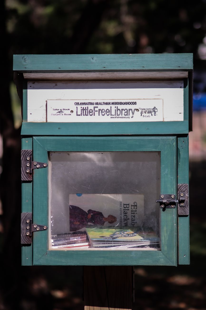 Handcrafted neighborhood book boxes foster reading exchange and block friendships